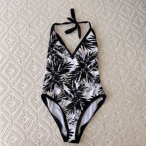 Women’s one piece swim suit, low back, full coverage, halter top. Size Medium.
